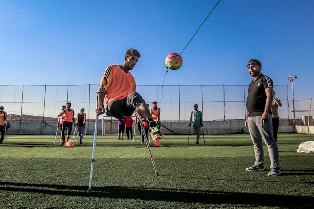 A disabled person playing soccer