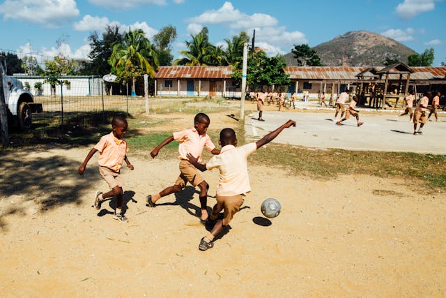 Soccer being played by children at school